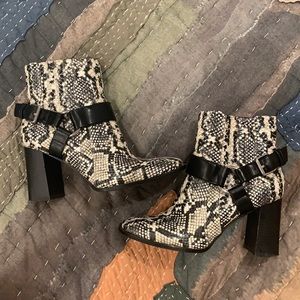 BCBG snake print black and white block heel boots.